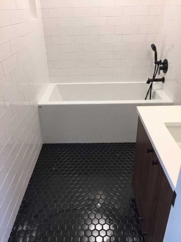 Bathtub Surround and Tile Floor Setting by Quinmor Tile